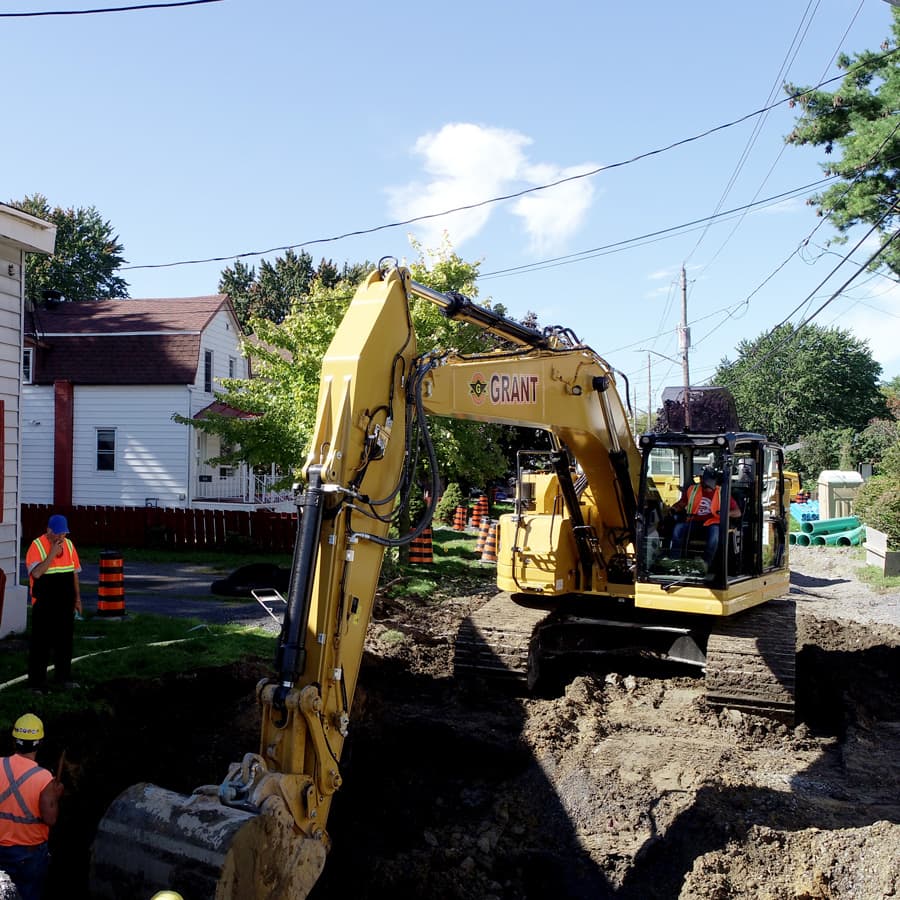 backhoe digging a water main